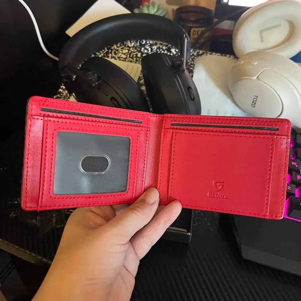 Men’s carbon fiber style wallet with bright red interior.